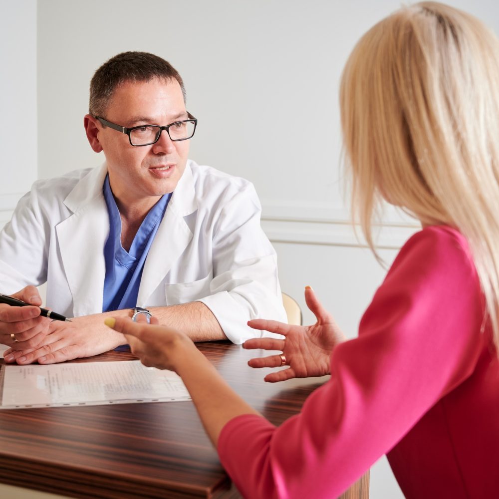 female-patient-having-consultation-with-doctor-in-clinic-.jpg